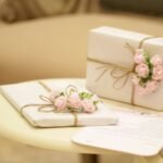 two pink and white floral boxes